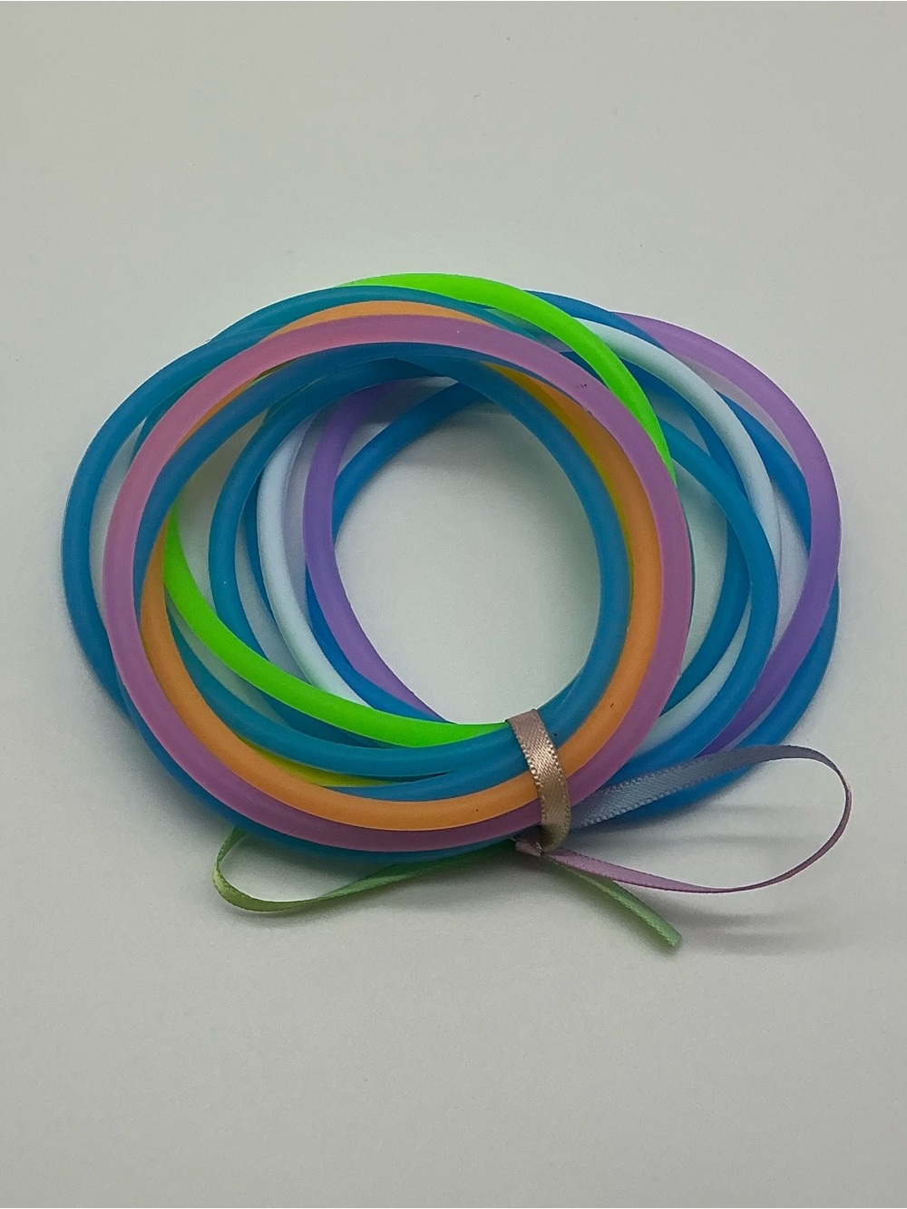 Set of 12 Neon Blue and Pastel Rainbow Colored Jelly Bracelets
